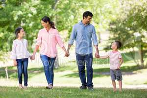 Happy family enjoying together in park