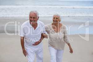 Senior couple having fun together at beach