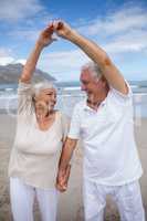 Senior couple having fun together at beach