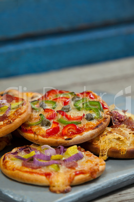 Various delicious italian pizza on pizza peel