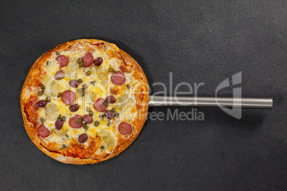 Delicious italian pizza served on pizza peel