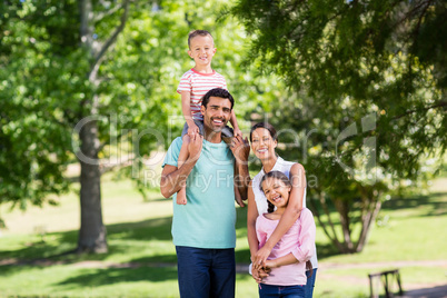 Portrait of happy family enjoying in park