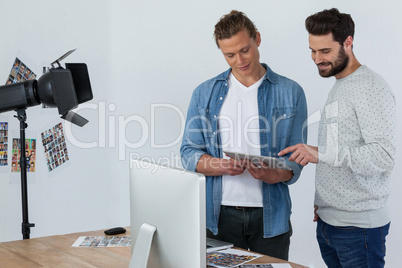 Photographers using digital tablet