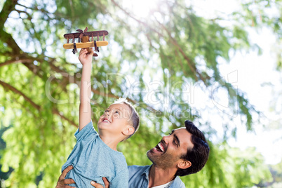 Father having fun with his son in park