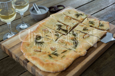 Slices of pizza served in a chopping board