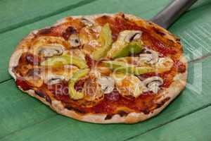 Delicious italian pizza served on pizza peel
