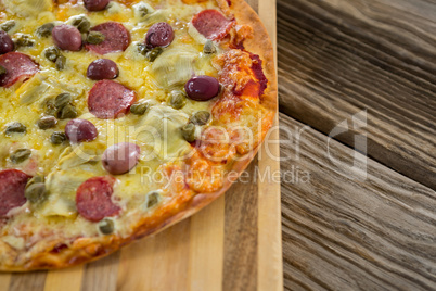 Italian pizza served in a chopping board