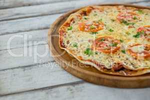 Italian pizza served on a wooden plank