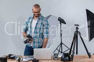 Male photographer working at desk