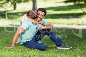 Father and son enjoying together in park