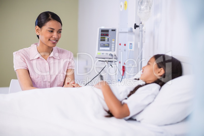 Nurse talking to a girl patient