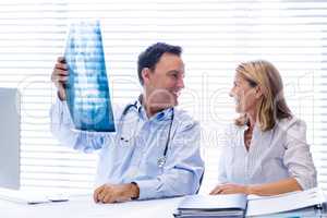 Doctor discussing x-ray report with patient