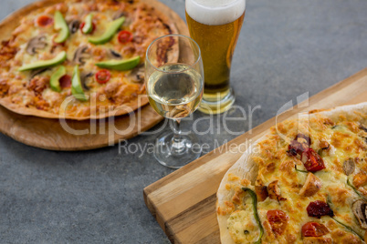 Italian pizza served with a beer glass