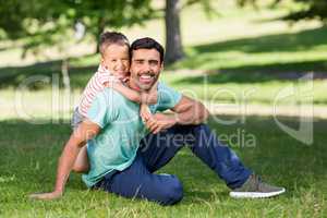 Father and son enjoying together in park