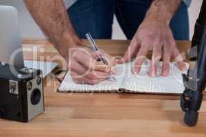 Male photographer working at desk