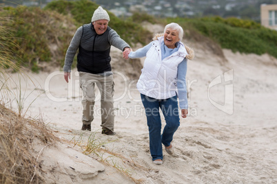 Senior couple having fun together at beach