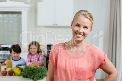 Portrait of beautiful woman smiling in kitchen