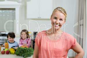 Portrait of beautiful woman smiling in kitchen