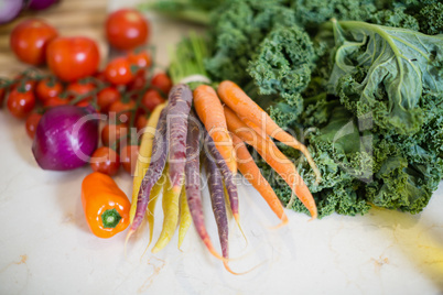 Various vegetables on kitchen worktop