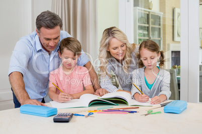 Parents assisting children doing homework