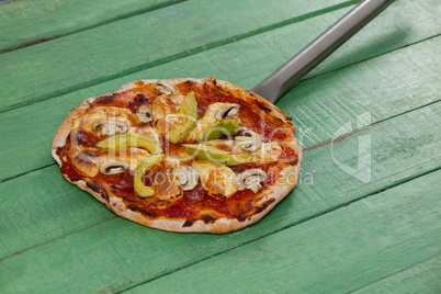 Delicious italian pizza served on pizza peel