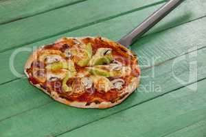 Delicious italian pizza served on pizza peel