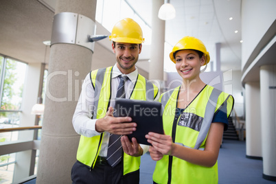 Architects holding digital tablet