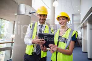 Architects holding digital tablet