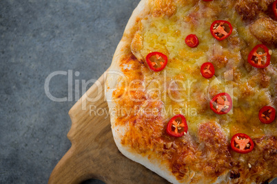 Pizza served in a chopping board