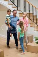 Parents and kids having fun in living room