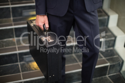 Businessman carrying briefcase