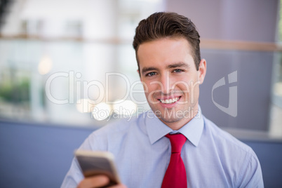 Businessman holding mobile phone