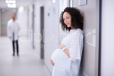 Portrait of pregnant woman standing in corridor Portrait of pregnant woman standing in corridor