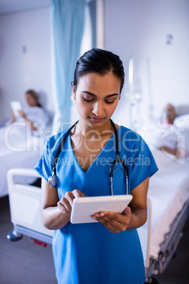 Beautiful female doctor using digital tablet Beautiful female doctor using digital tablet