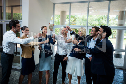 Business executives celebrating at conference center