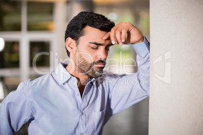 Stressed businessman at conference centre