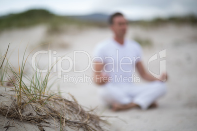 Mature man doing meditation