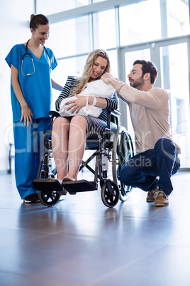 Couple looking at their newborn baby