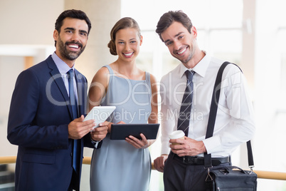 Business executives holding digital tablet Business executives holding digital tablet