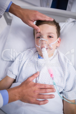 Doctor examining patient in corridor