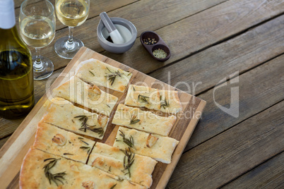 Slices of pizza served in a chopping board