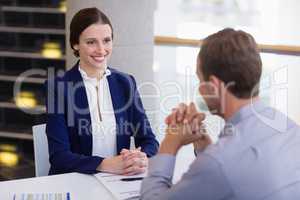 Business executives having a discussion at desk