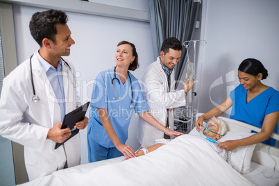 Doctors examining senior patient