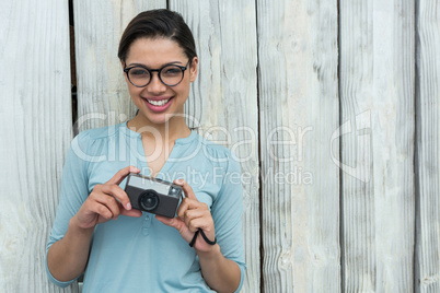 Female photographer with old fashioned camera