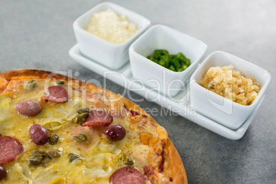 Italian pizza served with various ingredients