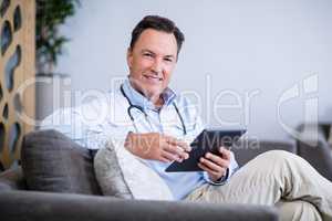Portrait of doctor using digital tablet