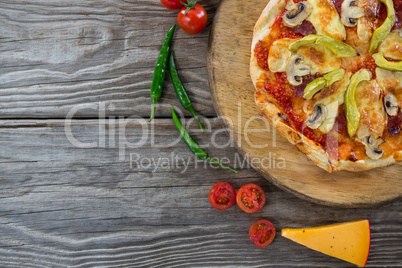 Various species with pizza arranged on wooden tray