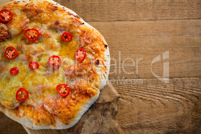 Pizza served on a chopping board