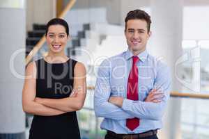 Confident business executives standing with arms crossed