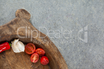 Spices and vegetable in wooden bowl